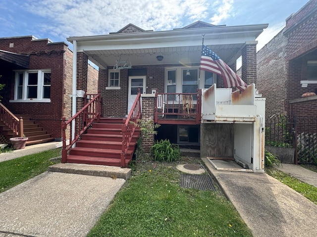 2439 S 57th Ave, Cicero, IL 60804 - view of front of property featuring stairway, a porch, and brick siding