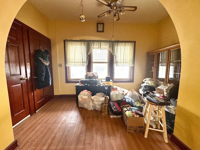 2439 S 57th Ave, Cicero, IL 60804 - foyer with arched walkways, wood finished floors, a ceiling fan, and baseboards