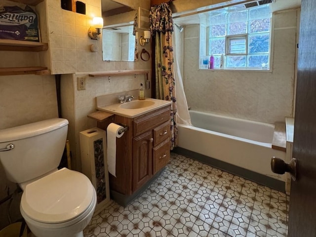 2439 S 57th Ave, Cicero, IL 60804 - full bath with toilet, shower / tub combo with curtain, tile walls, and vanity