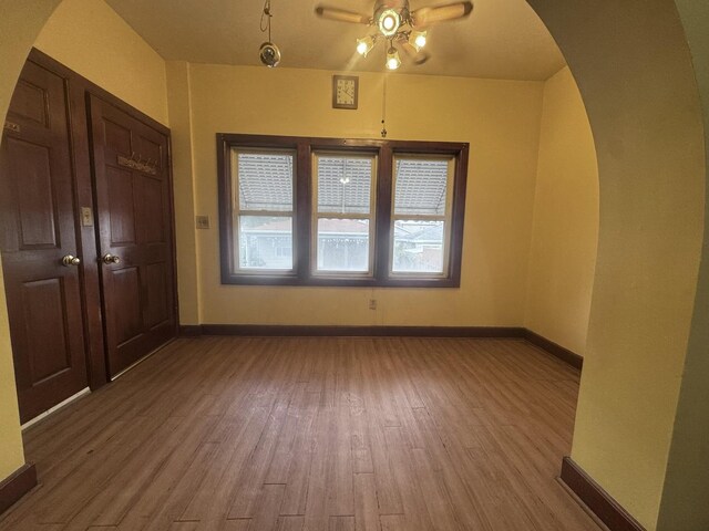 2439 S 57th Ave, Cicero, IL 60804 - bonus room with a ceiling fan, wood finished floors, and arched walkways