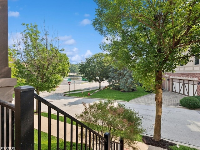 301 Brownstone Dr, Saint Charles, IL 60174 - view of yard with decorative driveway and a garage