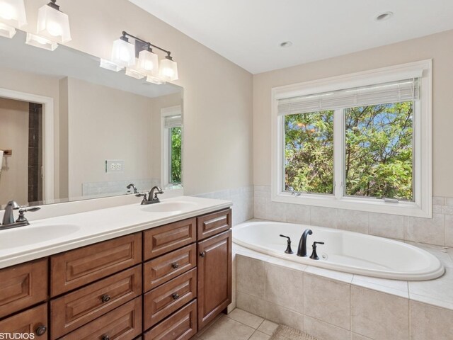 301 Brownstone Dr, Saint Charles, IL 60174 - bathroom with double vanity, a garden tub, plenty of natural light, and tile patterned flooring