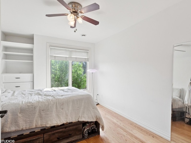 301 Brownstone Dr, Saint Charles, IL 60174 - bedroom with light wood-style flooring, baseboards, and a ceiling fan