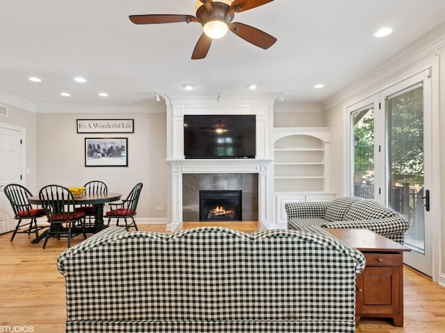 301 Brownstone Dr, Saint Charles, IL 60174 - living room featuring light wood finished floors, recessed lighting, ornamental molding, a fireplace, and a ceiling fan