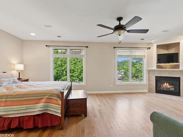 301 Brownstone Dr, Saint Charles, IL 60174 - bedroom featuring wood finished floors, a fireplace, baseboards, a ceiling fan, and recessed lighting