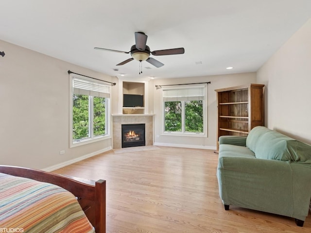 301 Brownstone Dr, Saint Charles, IL 60174 - bedroom featuring light wood-style flooring, a fireplace, a ceiling fan, baseboards, and recessed lighting