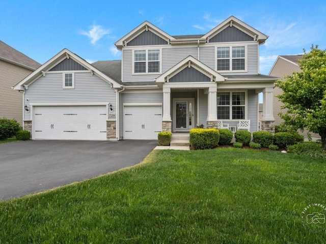 729 Hamilton Dr, South Elgin, IL 60177 - craftsman inspired home with stone siding, asphalt driveway, and board and batten siding