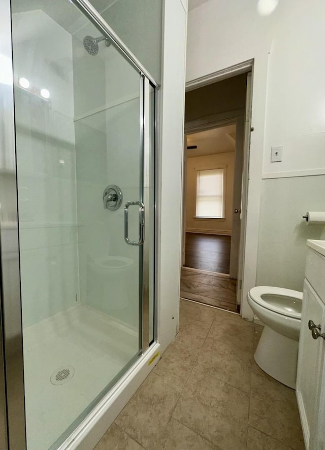 10749 S State St, Chicago, IL 60628 - full bath with a shower stall, toilet, vanity, and tile patterned flooring