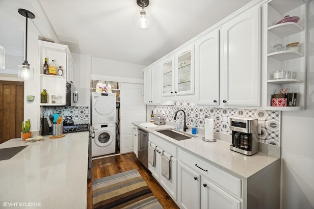 1112 Ontario St Unit 1E, Oak Park, IL 60302 - kitchen with a sink, open shelves, stacked washing machine and dryer, white cabinets, and tasteful backsplash