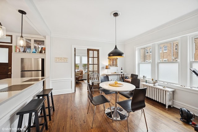 1112 Ontario St Unit 1E, Oak Park, IL 60302 - dining space with dark wood-type flooring, ornamental molding, radiator, and baseboards