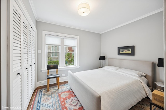 1112 Ontario St Unit 1E, Oak Park, IL 60302 - bedroom with crown molding, baseboards, wood finished floors, and a closet