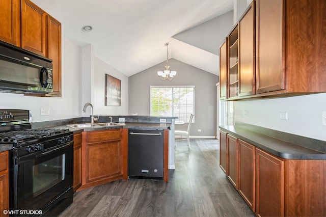 3330 Cameron Dr Unit 17-1, Elgin, IL 60124 - kitchen featuring black appliances, a sink, a peninsula, dark countertops, and lofted ceiling