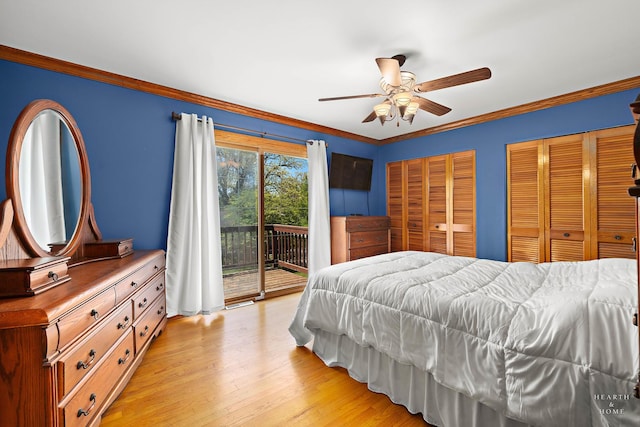 bedroom featuring access to outside, crown molding, light wood-style floors, multiple closets, and ceiling fan