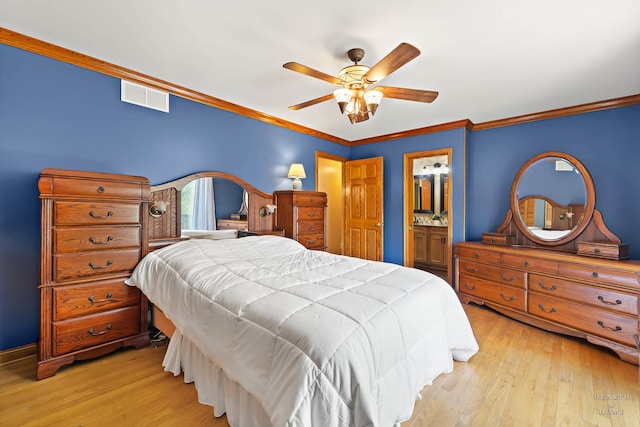 bedroom featuring crown molding, light wood-style flooring, a ceiling fan, and connected bathroom