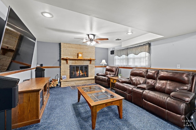 living room with carpet flooring, a ceiling fan, recessed lighting, and a stone fireplace