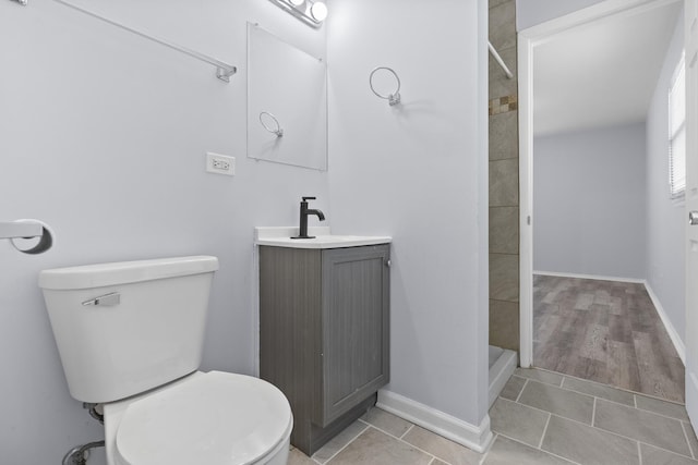 15503 Cherry St, South Holland, IL 60473 - full bathroom featuring toilet, tiled shower, vanity, and baseboards