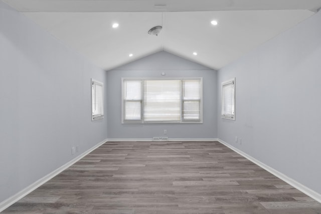 15503 Cherry St, South Holland, IL 60473 - unfurnished room with vaulted ceiling, wood finished floors, baseboards, and recessed lighting