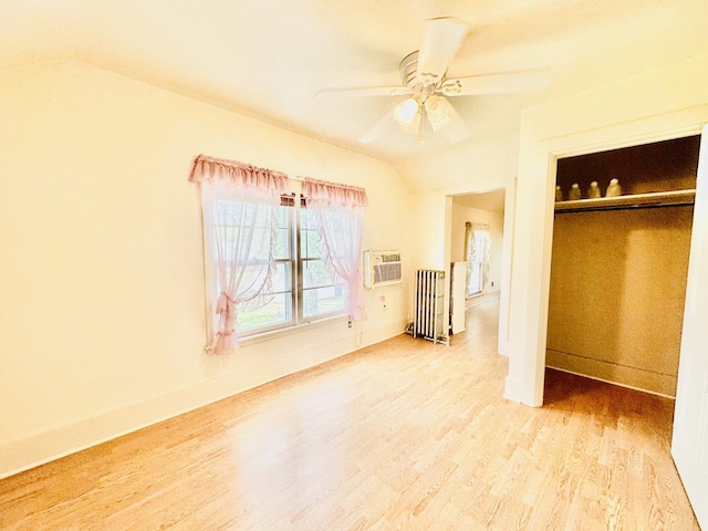 1115 E Wilson St, Streator, IL 61364 - bedroom with wood finished floors, radiator, a closet, lofted ceiling, and baseboards