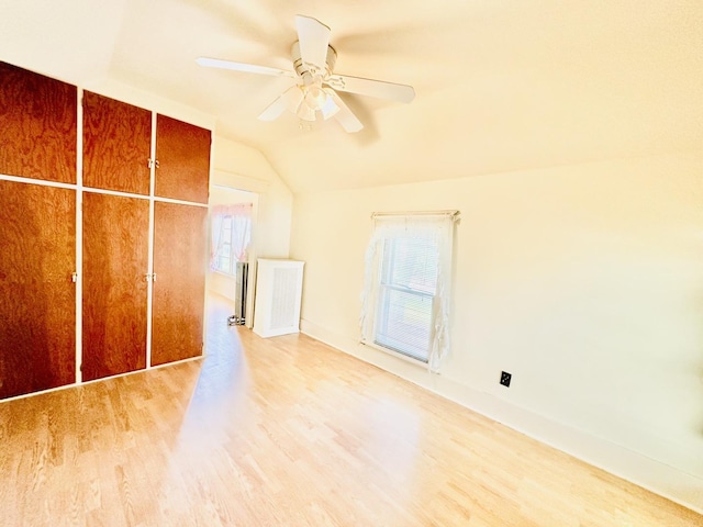 1115 E Wilson St, Streator, IL 61364 - bonus room featuring wood finished floors, lofted ceiling, a ceiling fan, and baseboards