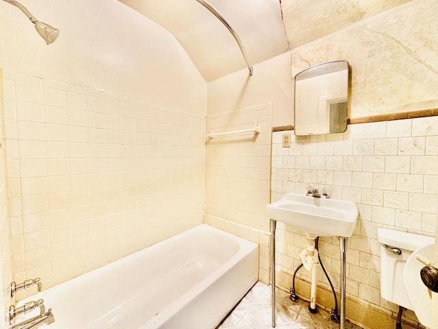 1115 E Wilson St, Streator, IL 61364 - full bathroom featuring lofted ceiling, tile walls, toilet, shower / washtub combination, and marble finish flooring