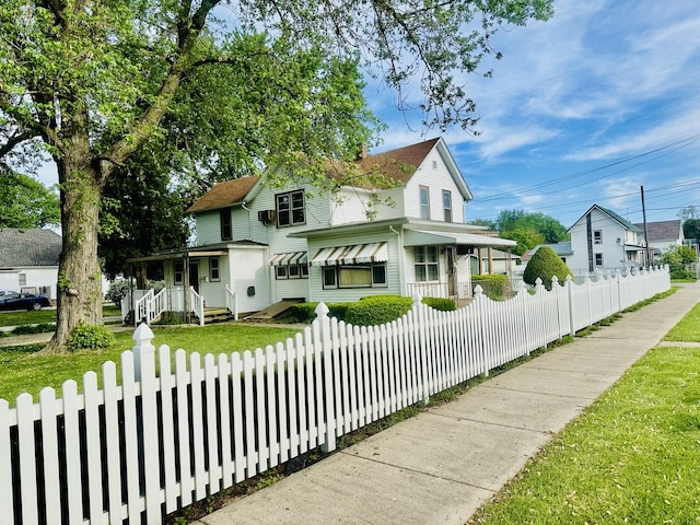 1115 E Wilson St, Streator, IL 61364 - view of front of house with a fenced front yard and a porch