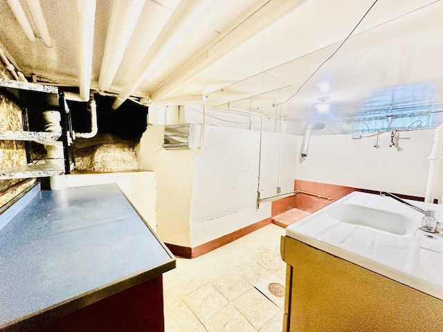 1115 E Wilson St, Streator, IL 61364 - unfinished basement with a sink and baseboards