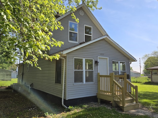 rear view of house with a lawn