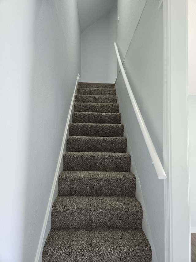 stairs featuring baseboards