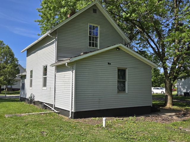 view of home's exterior featuring a yard