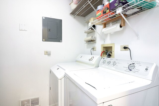 2169 Sunderland Ct Unit 101B, Naperville, IL 60565 - clothes washing area with electric panel and washer and dryer