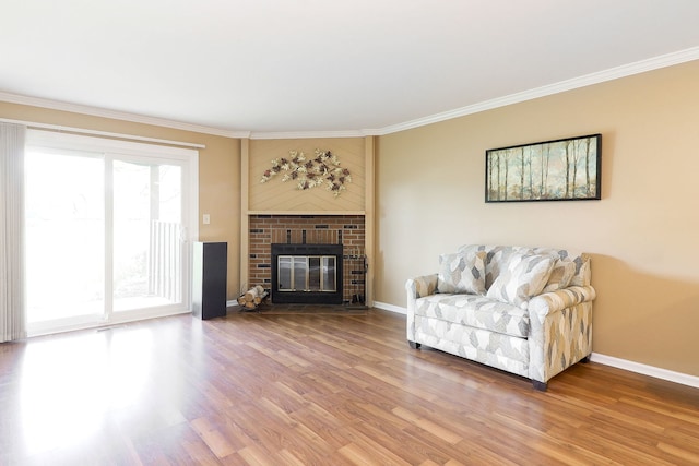 2169 Sunderland Ct Unit 101B, Naperville, IL 60565 - living room with wood finished floors, ornamental molding, baseboards, and a fireplace
