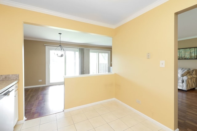 2169 Sunderland Ct Unit 101B, Naperville, IL 60565 - unfurnished dining area featuring baseboards, crown molding, and light wood finished floors
