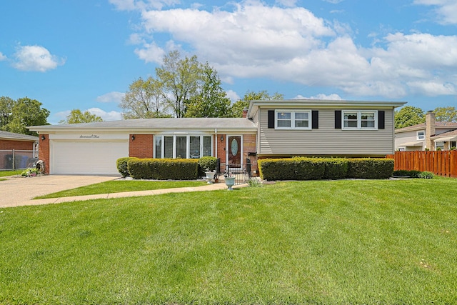 1703 W Robbie Ln, Mount Prospect, IL 60056 - tri-level home featuring an attached garage, brick siding, and driveway