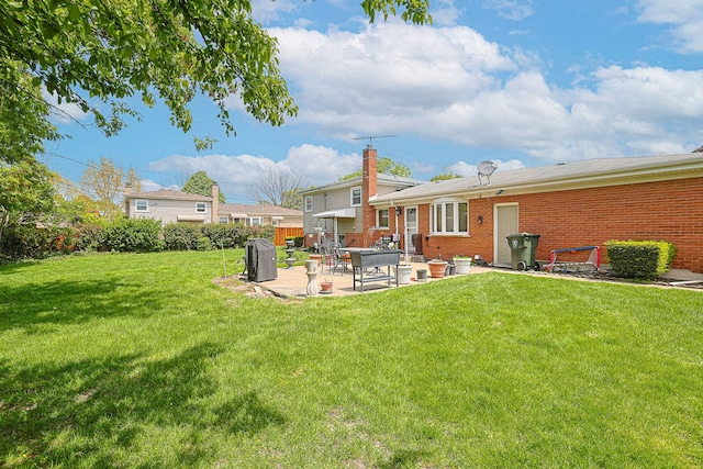 1703 W Robbie Ln, Mount Prospect, IL 60056 - view of grassy yard featuring a patio area