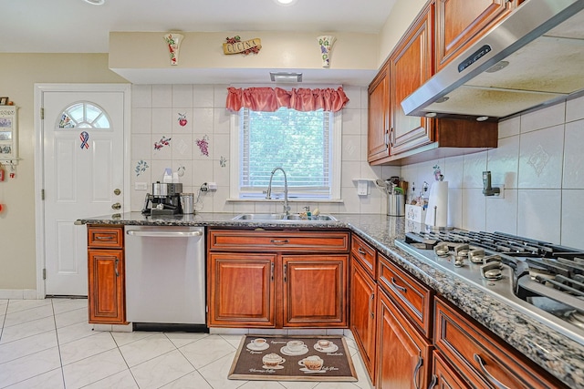 1703 W Robbie Ln, Mount Prospect, IL 60056 - kitchen featuring stainless steel appliances, a sink, under cabinet range hood, light tile patterned flooring, and decorative backsplash