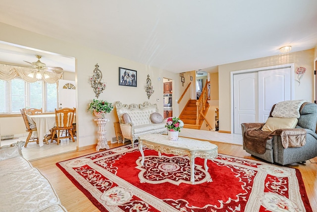 1703 W Robbie Ln, Mount Prospect, IL 60056 - living area with stairway, wood finished floors, and ceiling fan