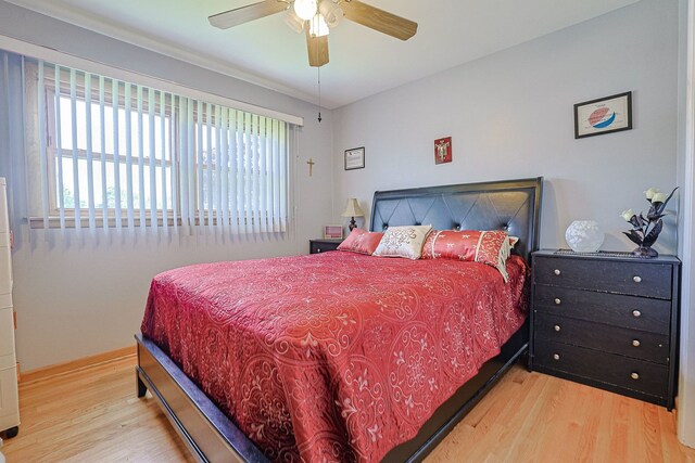 1703 W Robbie Ln, Mount Prospect, IL 60056 - bedroom with wood finished floors, a ceiling fan, and baseboards