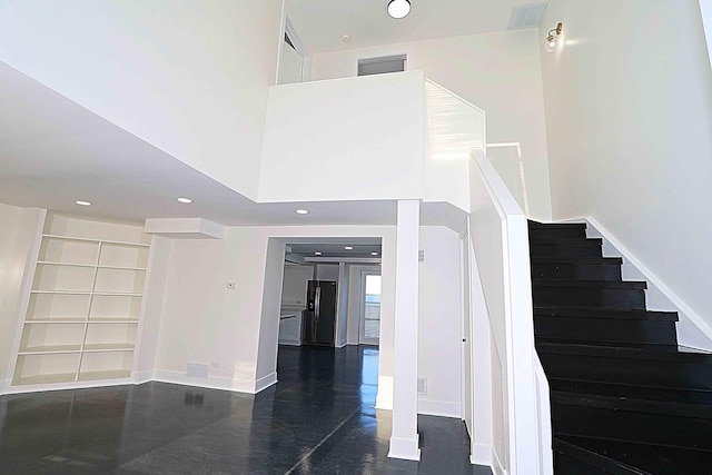 6337 Roosevelt Rd Unit 408, Berwyn, IL 60402 - stairway with baseboards, recessed lighting, built in shelves, and wood finished floors