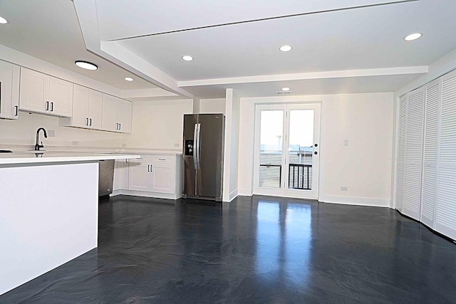 6337 Roosevelt Rd Unit 408, Berwyn, IL 60402 - kitchen featuring stainless steel fridge, baseboards, light countertops, white cabinetry, and recessed lighting