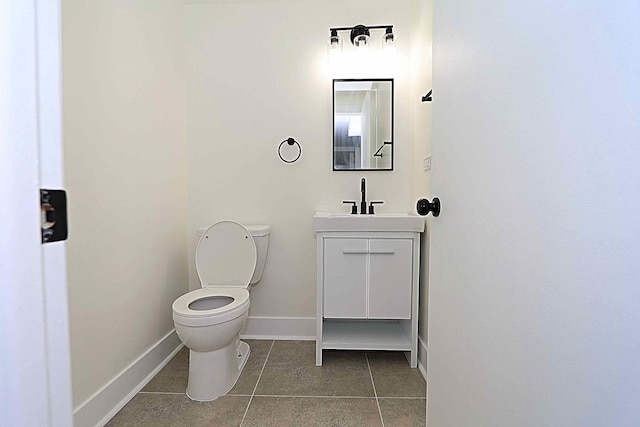 6337 Roosevelt Rd Unit 408, Berwyn, IL 60402 - bathroom with tile patterned flooring, toilet, vanity, and baseboards
