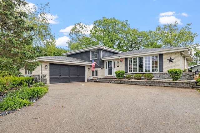 12826 Artesian St, Lemont, IL 60439 - split level home with asphalt driveway, an attached garage, and brick siding