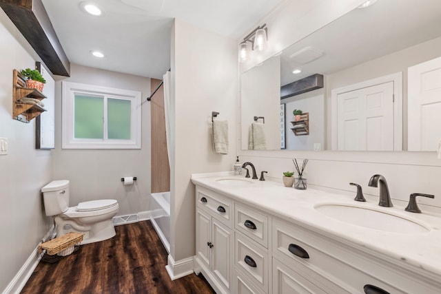 12826 Artesian St, Lemont, IL 60439 - full bathroom featuring baseboards, toilet, double vanity, wood finished floors, and shower / bath combination with curtain