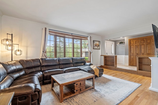 12826 Artesian St, Lemont, IL 60439 - living room featuring crown molding, wood finished floors, and wainscoting
