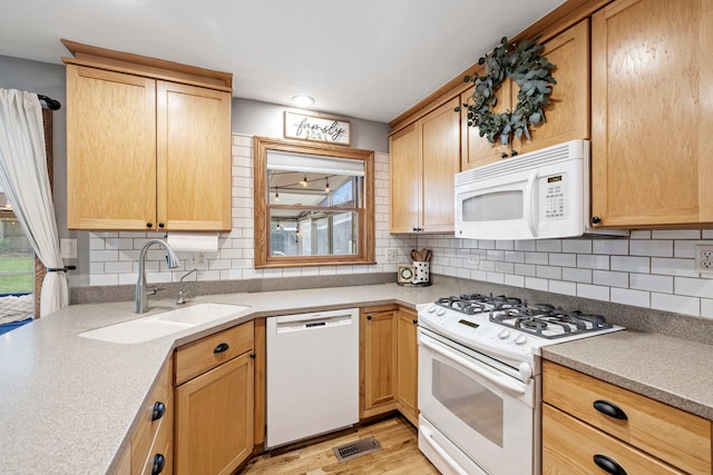 12826 Artesian St, Lemont, IL 60439 - kitchen with white appliances, a sink, tasteful backsplash, and healthy amount of natural light