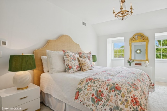 bedroom featuring a chandelier, lofted ceiling, and baseboards