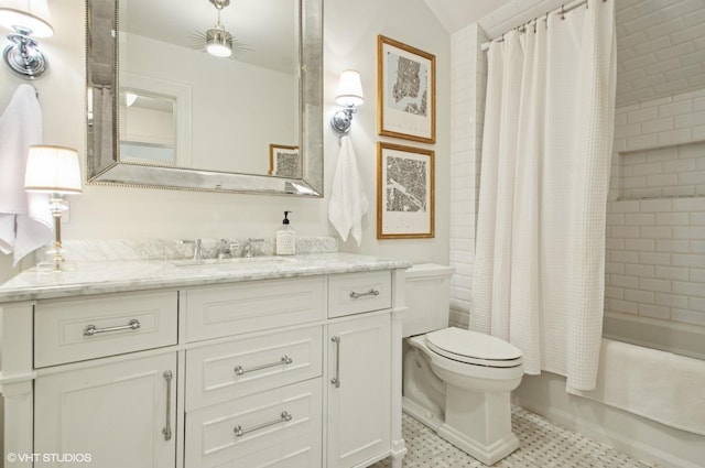 full bathroom with toilet, vanity, and shower / bath combo with shower curtain