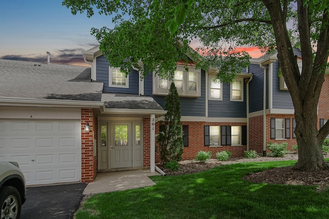 201 Charleston Ct Unit 2, Schaumburg, IL 60193 - townhome / multi-family property with brick siding, a garage, and a front yard