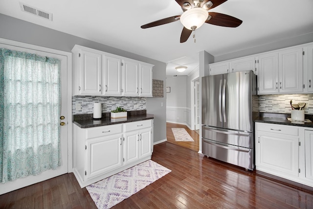 201 Charleston Ct Unit 2, Schaumburg, IL 60193 - kitchen with freestanding refrigerator, white cabinets, ceiling fan, decorative backsplash, and a wainscoted wall