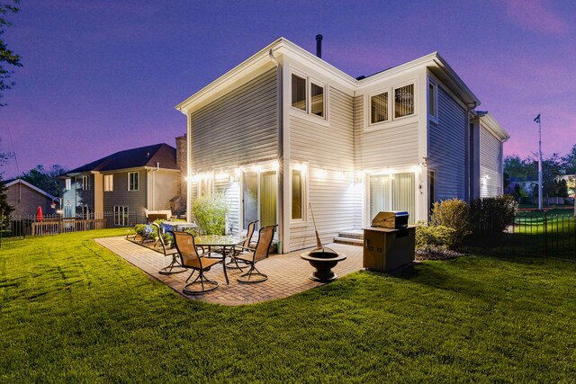 417 Lake Shore Blvd, Wauconda, IL 60084 - back of property at dusk featuring a patio area