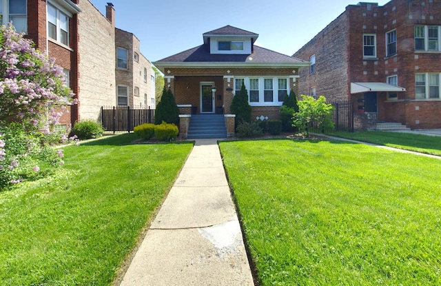 bungalow-style home featuring brick siding
